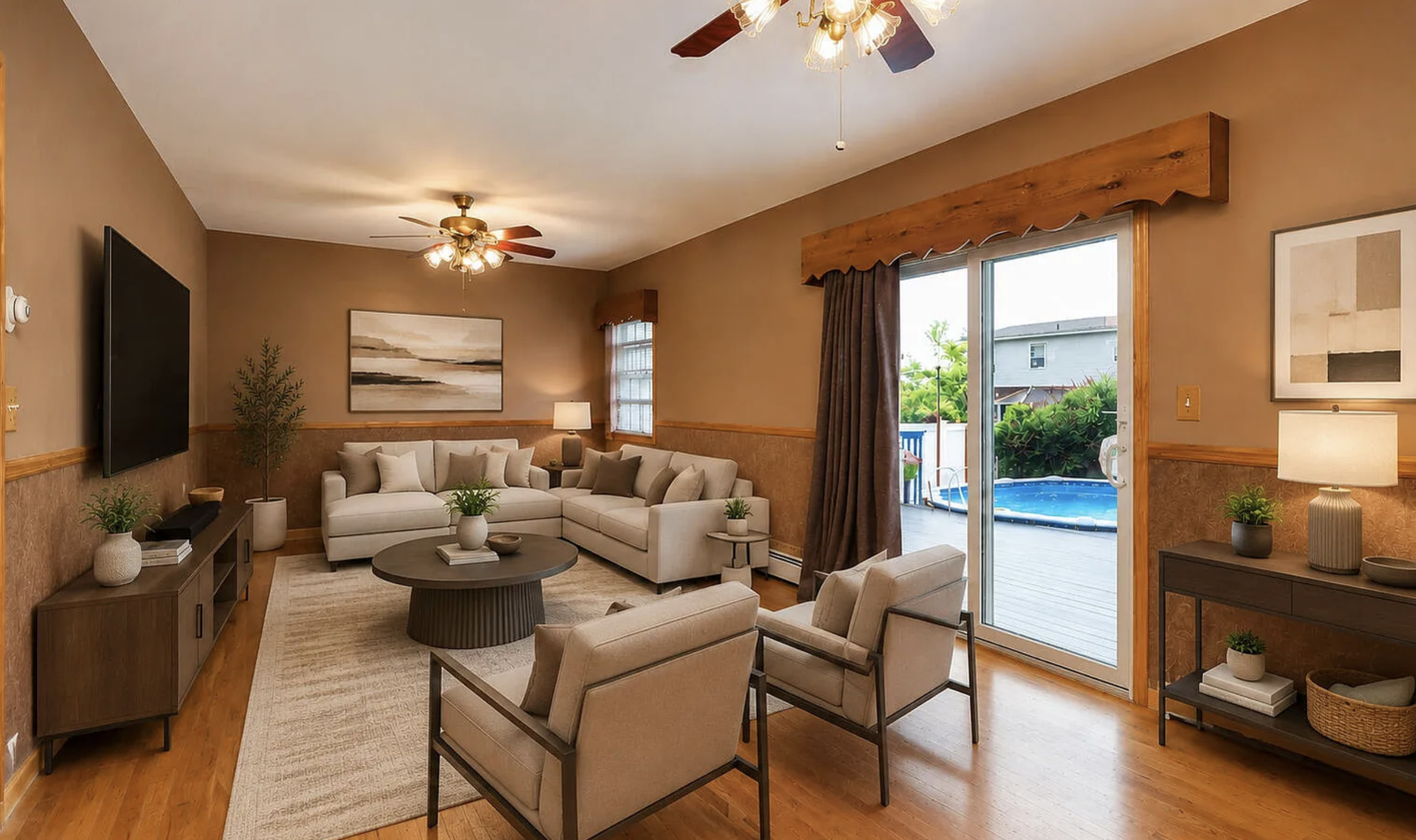 This spacious living room features a comfortable sectional sofa and two accent chairs, arranged around a large circular coffee table. The walls are painted a warm brown, complem...